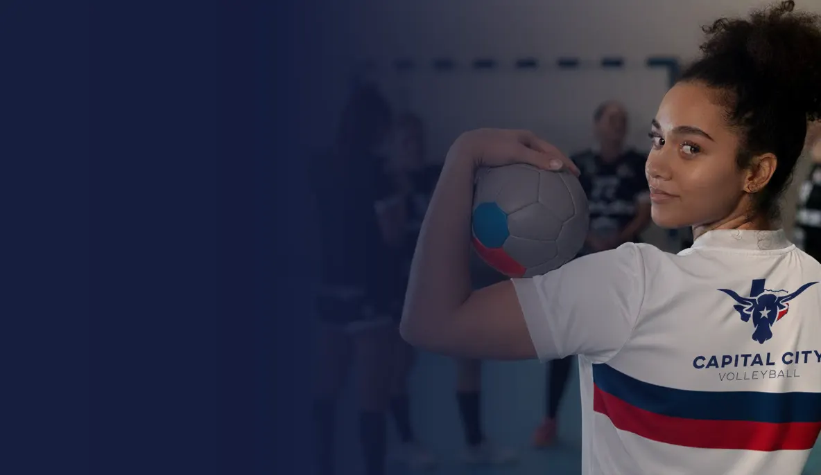 Capital City Volleyball player serving a ball